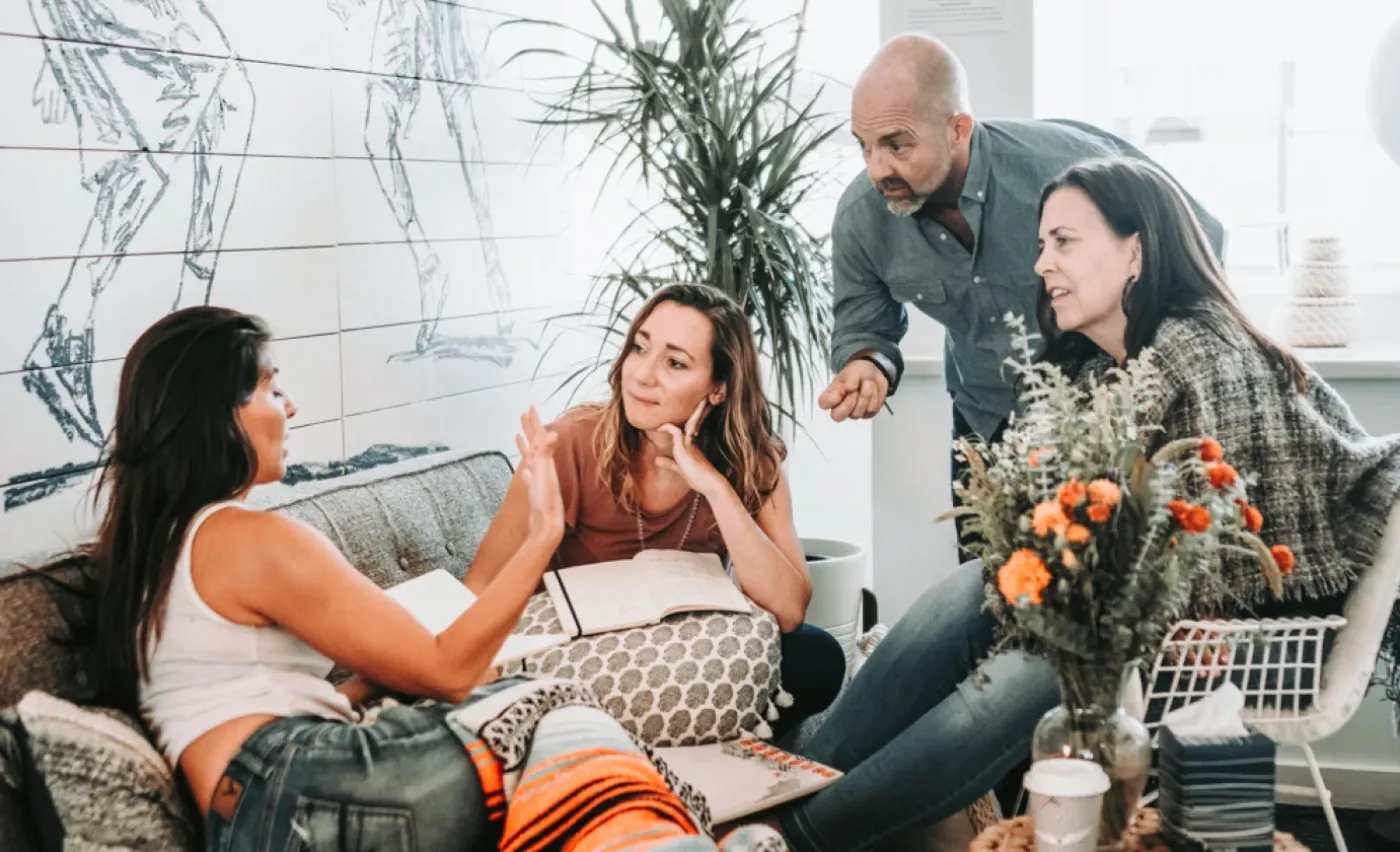 Kyle Mercer in conversation with three founders, mid-inquiry